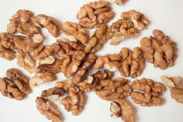  walnuts on a white background.  banner about diet and healthy eating