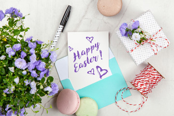 Happy Easter postcard on white marble table