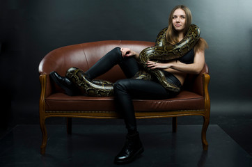 Obraz na płótnie Canvas sensual girl and python in studio