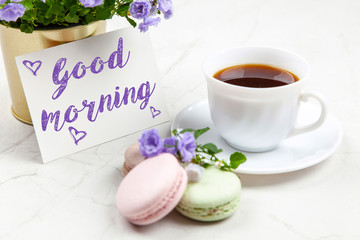 Good Morning postcard on white marble table