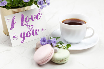 I Love You postcard on white marble table