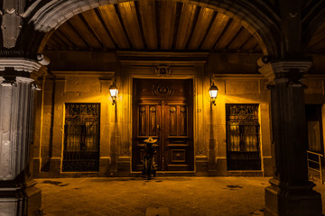 woman entering old building