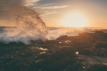 Fototapeta na wymiar Amazing beach sunset with beautiful sunset and incredible foamy waves