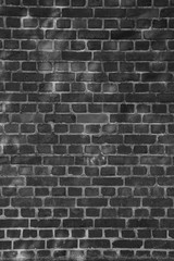 Backsteinwand in schwarz-weiß
