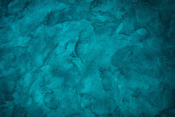 Textured bright teal concrete background
