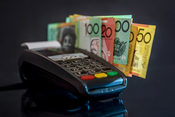 Selective focus on australian dollar banknotes with terminal