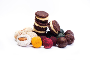 Raw vegan healthy candy on a white background. Isolated objects. Place for text. Homemade diet sweets
