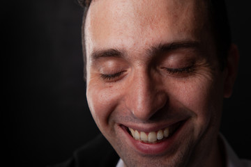 Obraz premium Portrait of a man, smiling, brunette, positive mood, emotions, lifestyle.