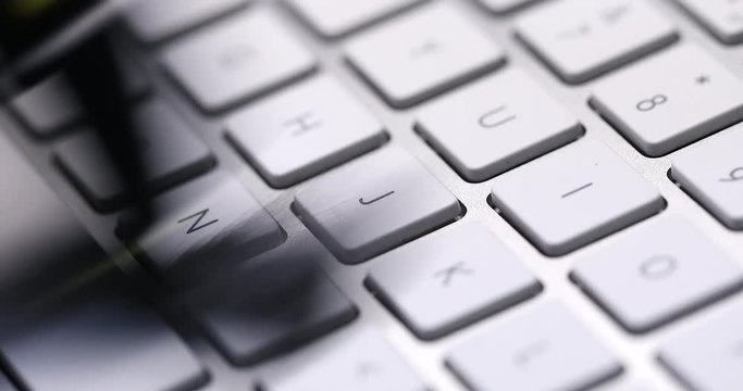 Computer keyboard cleaning with brush, closeup  detail