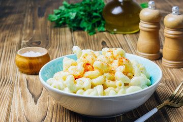 Mac and cheese, american style macaroni pasta with cheesy sauce