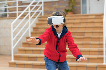boy playing at home with virtual reality glasses