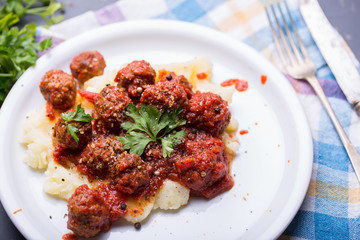 Tasty details of tomato meatballs with mash