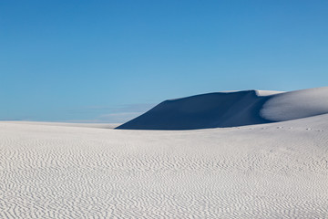 Fototapeta na wymiar Shadows on the sand dunes, at White Sands National Monument, New Mexico