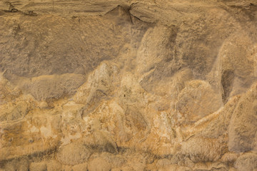 yellow and brown dirty natural stone wall surface background wallpaper pattern concept photography