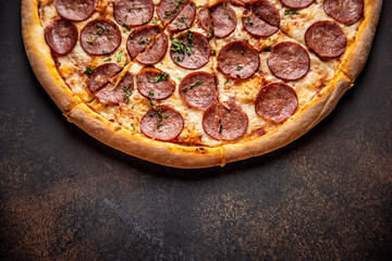 Pizza pepperoni on wooden table close up