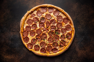 Pizza pepperoni on wooden table close up