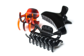 group of plastic hair clips on white background