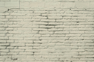 Old brick wall with grey paint background texture