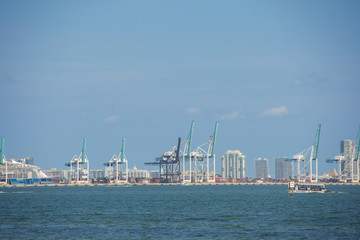 Obraz premium Telehpoto photo Port of Miami cranes harbor