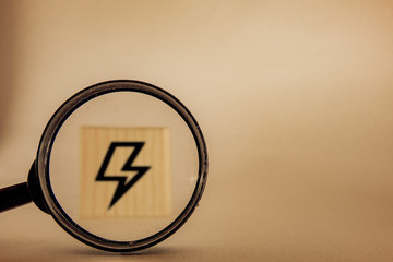 magnifying glass zooming in on lightning icon