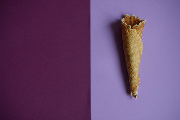 Waffle cone on colored geometric shapes