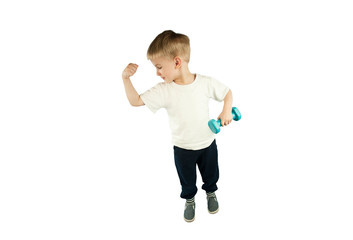 sporty little boy with dumbbells shows his muscles on an isolated blue background. The concept of a healthy lifestyle