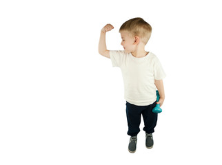 sporty little boy with dumbbells shows his muscles on an isolated blue background. The concept of a healthy lifestyle