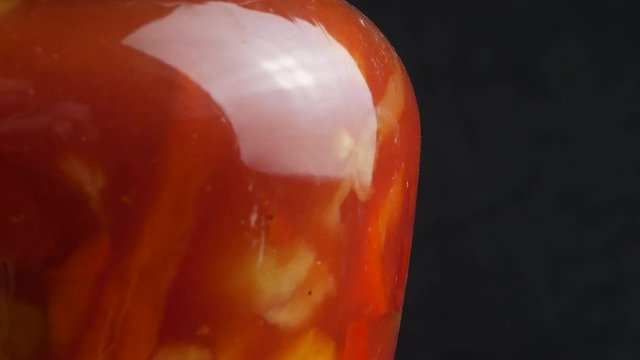 Canned vegetable lecho in a glass jar