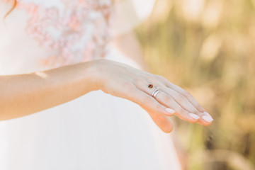 hands girl bride white dress ring flowers