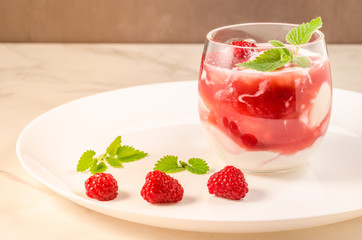 Health and diet concept/Healthy breakfast - yogurt with raspberry and mint