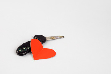 Car keys and red heart. give car keys.