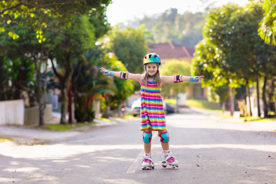 Child On Inline Skates. Kids Skate Roller Blades.