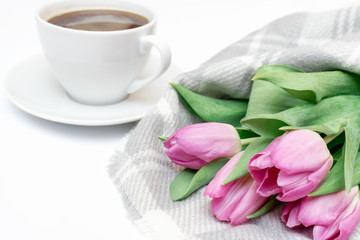 Fototapeta na wymiar Woman working desk with coffee mug, notebook and spring pink bouquet of tulip flowers, feminine flat lay style