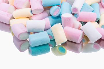 Colored marshmallow on a mirror