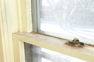 Old Wooden Window in Need of Replacement in Home