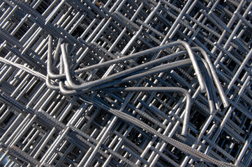 Billets of reinforcement at the construction site. Construction of the building with the help of reinforced concrete. Reinforcement of concrete base.