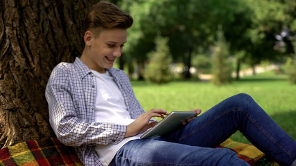 Teenage boy typing query in browser search bar, private access, parental control