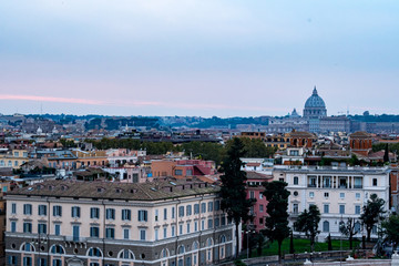 Fototapeta premium Sunset hour in Rome, Italy with cityscapes and rooftop views
