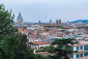 Sunset hour in Rome, Italy with cityscapes and rooftop views