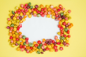 multi-colored popcorn on a bright background.concept of cinema,copy spase