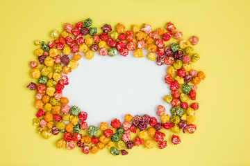 multi-colored popcorn on a bright background.concept of cinema,copy spase