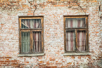 Abandoned brick building with broken windows