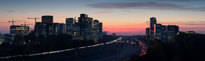 Naklejka na ściany i meble Sunset cityscape of Zuidas the business and commercial zone of Amsterdam.