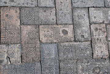 Close-up of dirty, patterned brick street paver detail on a Savannah, Georgia, street