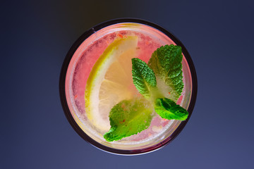 Top view of raspberry and lemon non-alcoholic drink with mint