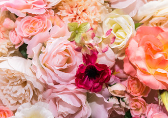 colorful background from bright tones; artificial flowers made of fabric