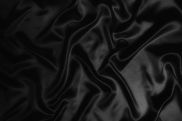 black abstract background luxury cloth or liquid wave or wavy folds of grunge silk texture satin velvet material or luxurious Christmas background or elegant wallpaper design, background