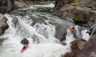 waterfall in mountains and Kayaks