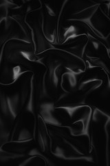 black abstract background luxury cloth or liquid wave or wavy folds of grunge silk texture satin velvet material or luxurious Christmas background or elegant wallpaper design, background