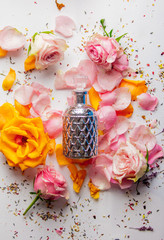 perfume bottle with roses and lavender petals